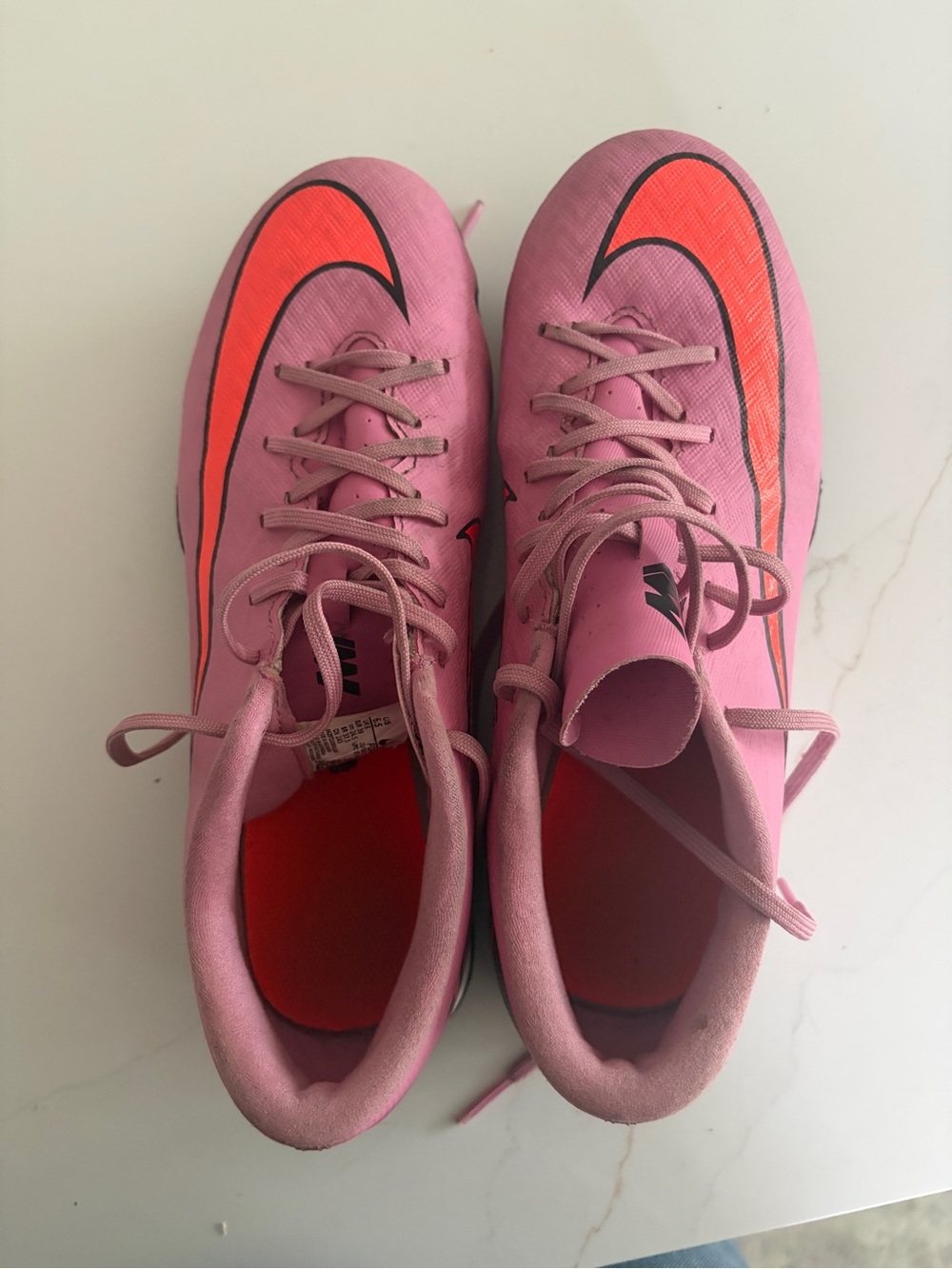 Nike Pink Soccer Turf shoes with Orange Swoosh